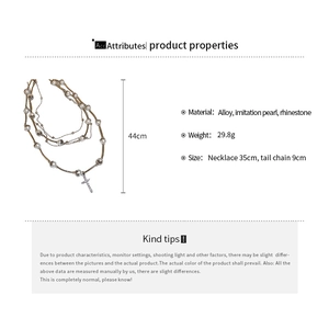 Detail view of multi-layer necklace showing dimensions of 44cm and cross pendant