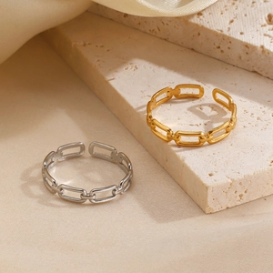 Minimalist square geometric chain link open rings in gold and silver finish on stone