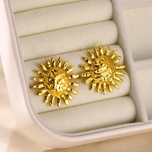 Vintage gold sunflower stud earrings in stainless steel with irregular sunburst texture