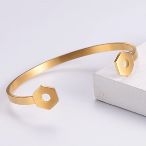 Brushed gold stainless steel open bangle with hexagonal details for men stylish design