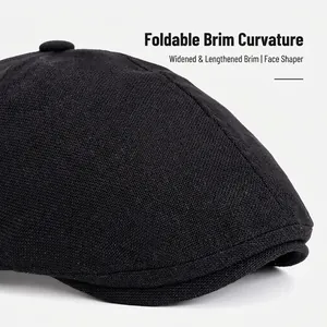 Classic black newsboy cap with flexible brim and wide sun visor for face contouring