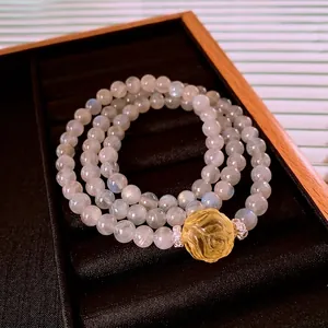 Three-layer moonstone beaded bracelet with a yellow rose carving and silver spacers