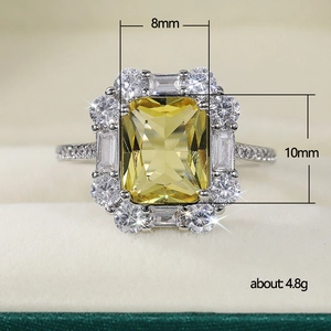 Sparkling radiant cut yellow zircon ring with 8x10mm main stone and halo accents