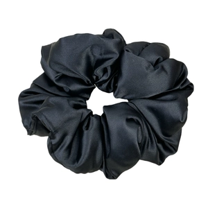 French style black satin oversized scrunchie with a glossy silk texture on white background