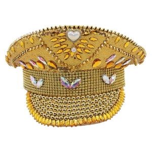Macro detail of hand-stitched gold sequins and teardrop rhinestones on the captain hat