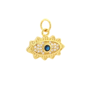 Macro detail of gold evil eye pendant featuring a blue gemstone and zircon accents