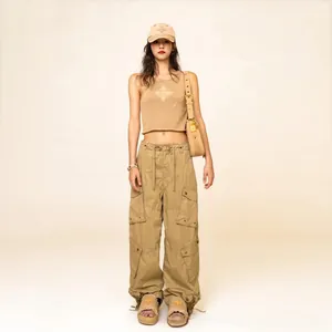 Detail of cargo pants with multiple utility pockets and adjustable wide-leg fit