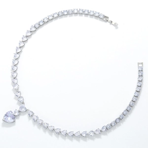 Close-up of heart-shaped pendant with sparkling cubic zirconia on a silver-tone chain