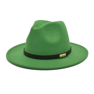 Detail of green wool fedora hat featuring a thin black leather band and gold metal buckle