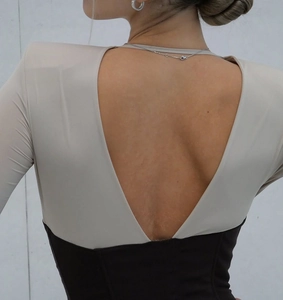 Detail showing the deep V backless design with contrast patchwork on a slim fit dress