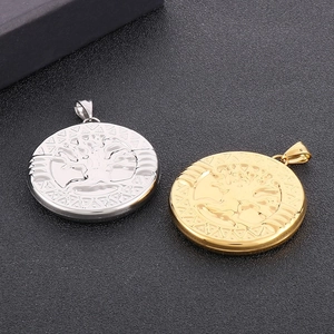 Detailed view of silver and gold hollow Tree of Life steel pendants with geometric edges