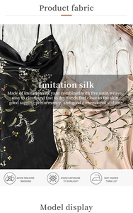 Detail of floral imitation silk satin fabric texture and laundry care instructions label