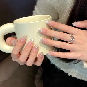 Handmade cat-eye press-on nails featuring silver glitter gradient and rhinestone accents