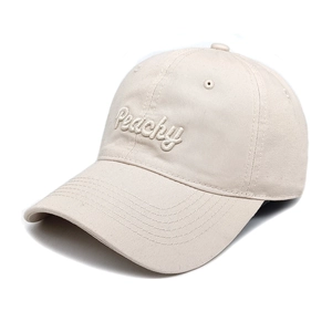 Close-up of Peachy 3D embroidery detail on a beige cotton twill baseball cap
