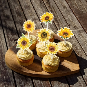 Macro shot of 6 sunflower cake toppers made of premium paper on wooden sticks decorations