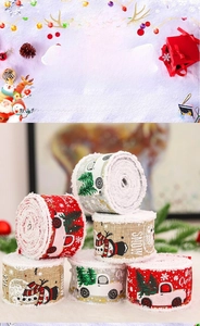 Close-up of 6 rolls of Christmas burlap ribbons with truck and snowman holiday patterns