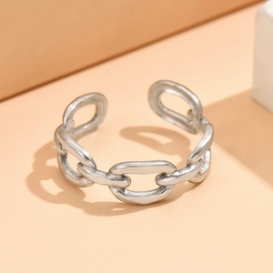 Minimalist adjustable stainless steel chain link ring in silver on geometric background
