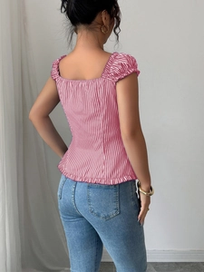 Detailed back view of a striped puff sleeve top with ruffled hem and slim fit design