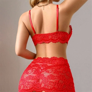 Close-up of red floral lace detailing on the high-waisted skirt and adjustable straps