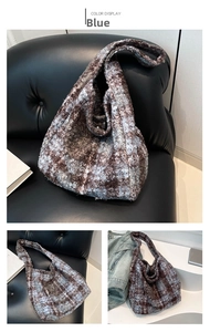 Detail of blue and coffee checkered faux fur tote bag with plush textured fabric