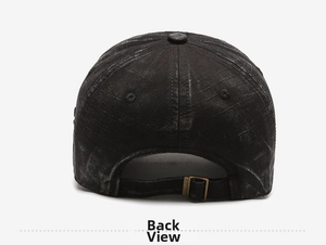 Detail view of the vintage washed black denim cap featuring an adjustable metal buckle