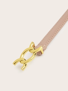 Close-up of pink leather belt with golden interlocking horsebit buckle and fine stitching