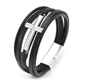 Detail of multi-layer black leather bracelet with silver cross and magnetic clasp