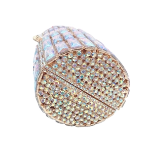 Lipstick shaped evening clutch bag with sparkling crystals and gold metal finish