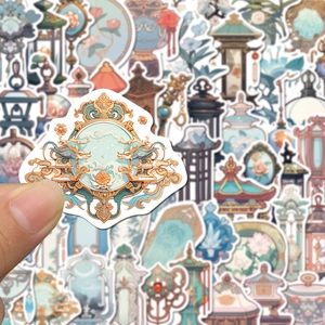 Detailed view of Chinese style stickers featuring dragon and bamboo motifs on paper