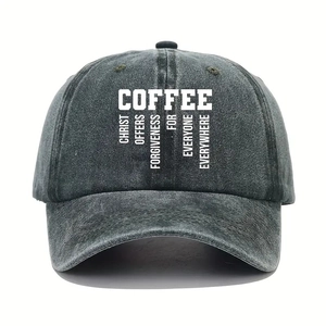 Detailed view of COFFEE text print on a dark gray washed cotton baseball cap