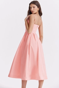 Detail of elegant pink backless maxi dress showing back zipper and pleats structure