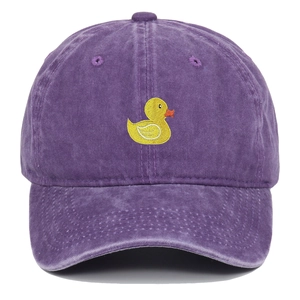 Close-up of yellow duck embroidery on a purple washed cotton vintage baseball cap