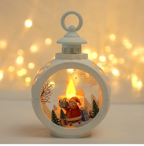 Close-up of a white Christmas lantern with Santa Claus and warm LED candle light