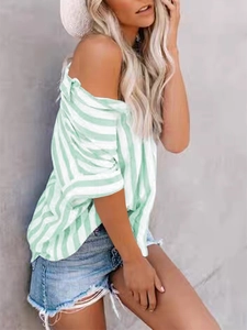Detail view of mint green and white striped cotton blouse with off-shoulder cut and 3/4 sleeves
