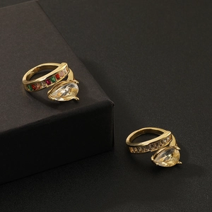 Two adjustable gold rings with pear and rectangular cut colorful zircon stones