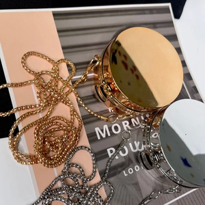 Mini acrylic round evening bag with gold and silver mirror finish and metal chain