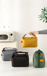 Close-up of insulated lunch bags in four colors made of high-density Oxford fabric