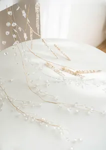 Macro detail of acrylic snowflake beads and golden wheat stalks for Christmas tree decor