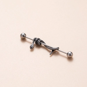 Detail of silver stainless steel industrial barbell featuring a 3D snake wrap design