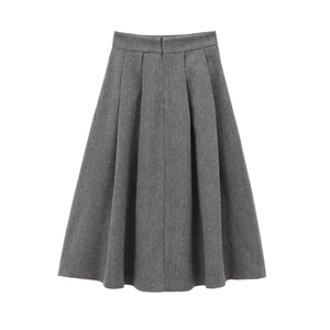 Detailed view of gray herringbone wool pleated skirt with high-waisted A-line silhouette