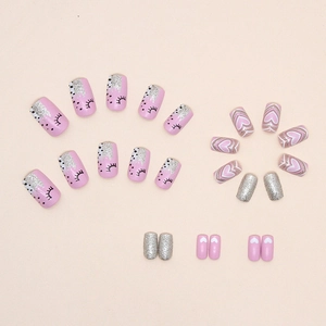 Pink glitter press-on nails with heart designs and sequin accents in a minimalist style