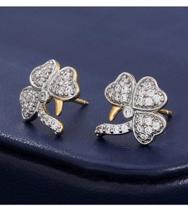 Macro shot of micro-pasted zircon clover stud earrings with 925 silver needles