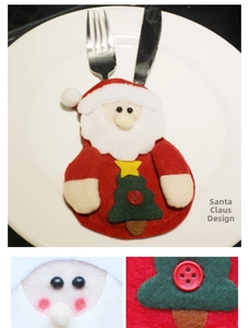 Close-up of Santa Claus cutlery holder featuring felt details and Christmas tree ornament
