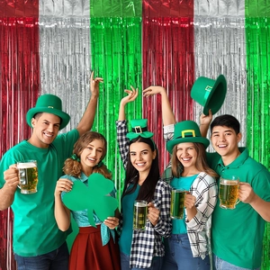 St. Patrick's Day celebration backdrop featuring red white green foil fringe curtains