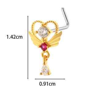 Detail view of 20G titanium heart wing nose stud with red gem and zircon accents