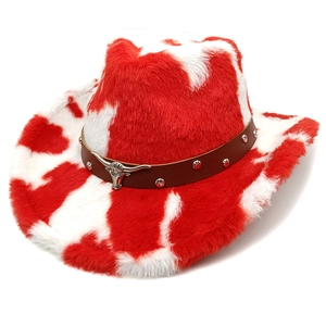 Detail of red and white cow print cowboy hat with studded leather band and bull head metal ornament
