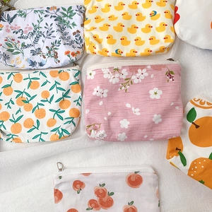 Mini floral and cartoon canvas coin purses with zippers in multiple cute patterns