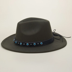 Detail of olive green fedora with black ethnic band featuring turquoise and silver studs