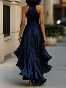 Detail of the backless design and satin texture on the navy blue V-neck evening dress