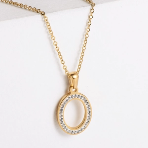 Macro shot of 18k gold plated ring pendant necklace with sparkling white zircons